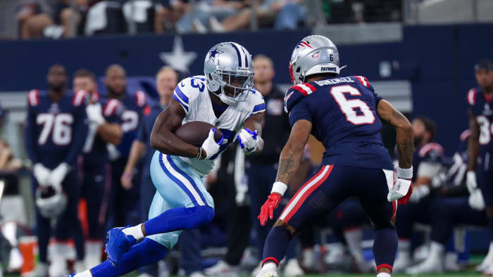 Oct 1, 2023; Arlington, Texas, USA; Dallas Cowboys wide receiver Michael Gallup (13) runs with the ball as New England Patriots cornerback Christian Gonzalez (6) defends during the first quarter at AT&T Stadium.